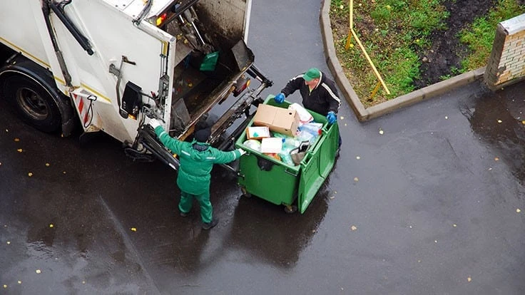 recycling bin colleciton truck men