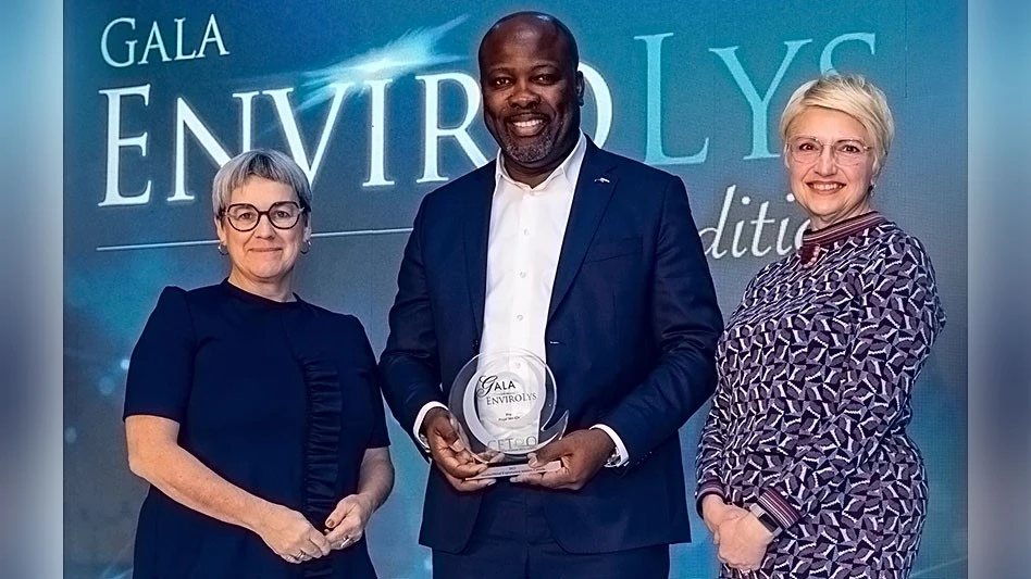 three people receiving an award