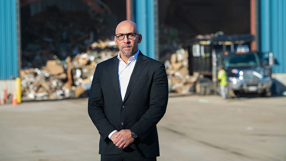 patsy sperduto stands in front of a transfer station