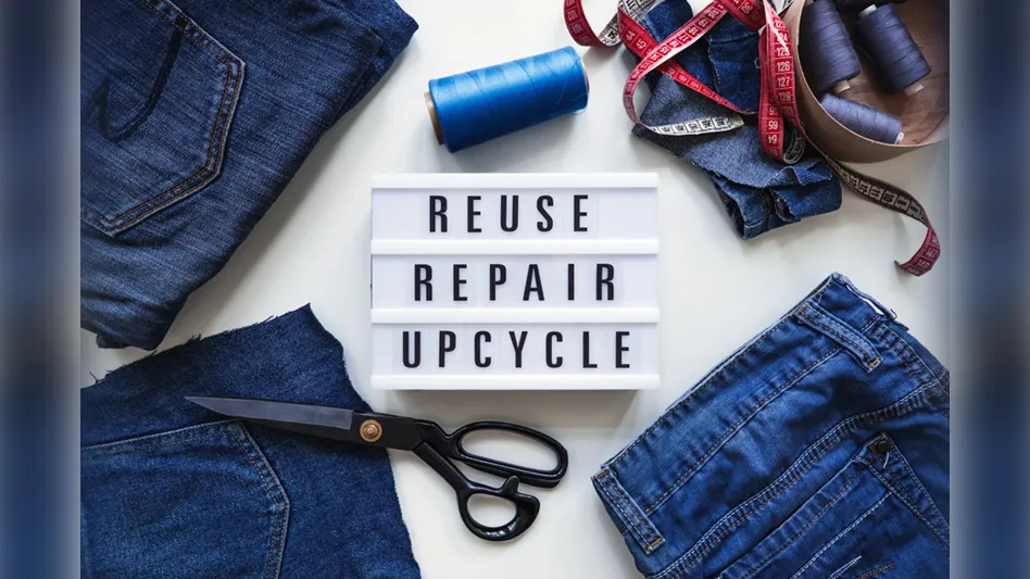 denim surrounding "Reuse, Repair, Upcycle" sign