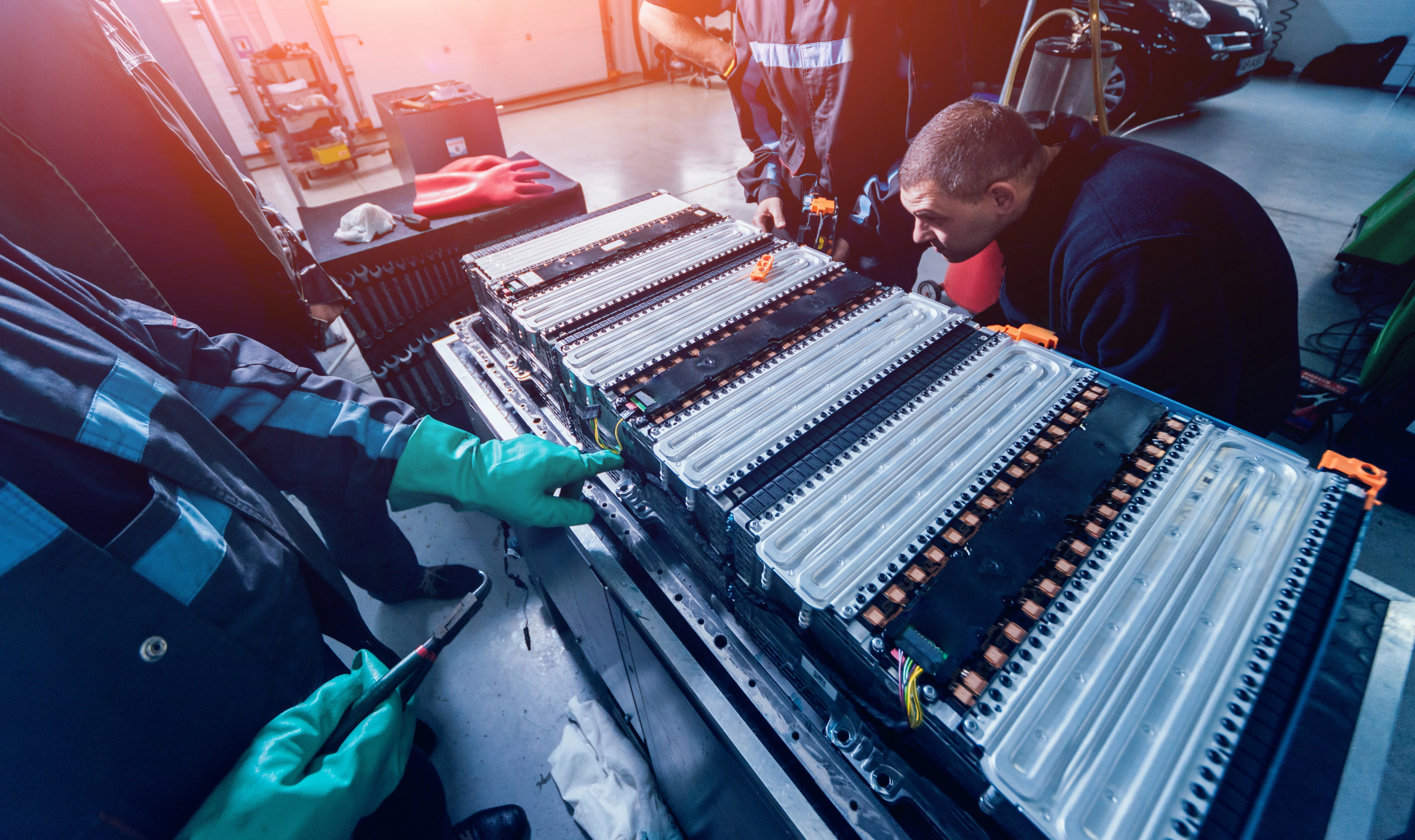 technicians working on an EV battery