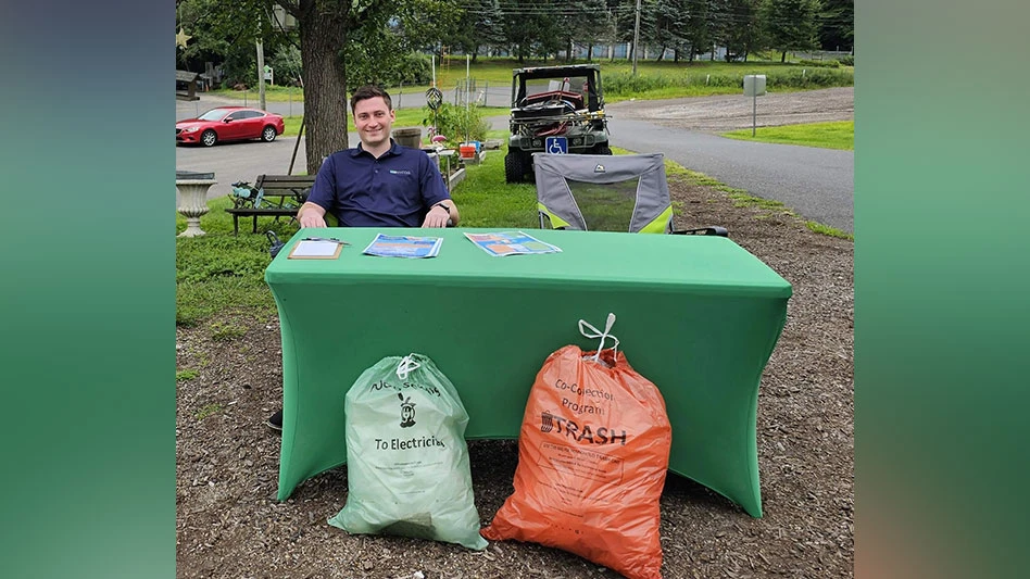 man, green table, green trash bag, orange trash bag