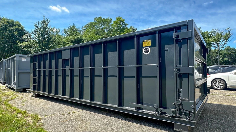 photo of a gray roll-off dumpster