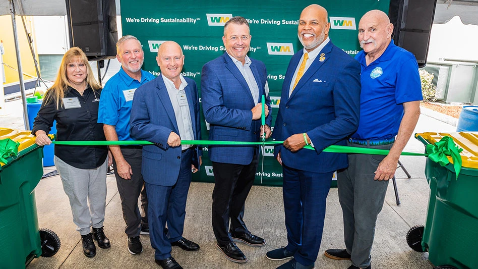 a women and five men cut the ribbon to open wm brevard