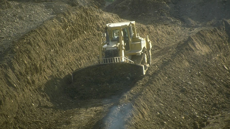 Caterpillar slot dozing downhill