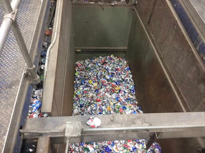 aluminum cans in a bunker at a MRF