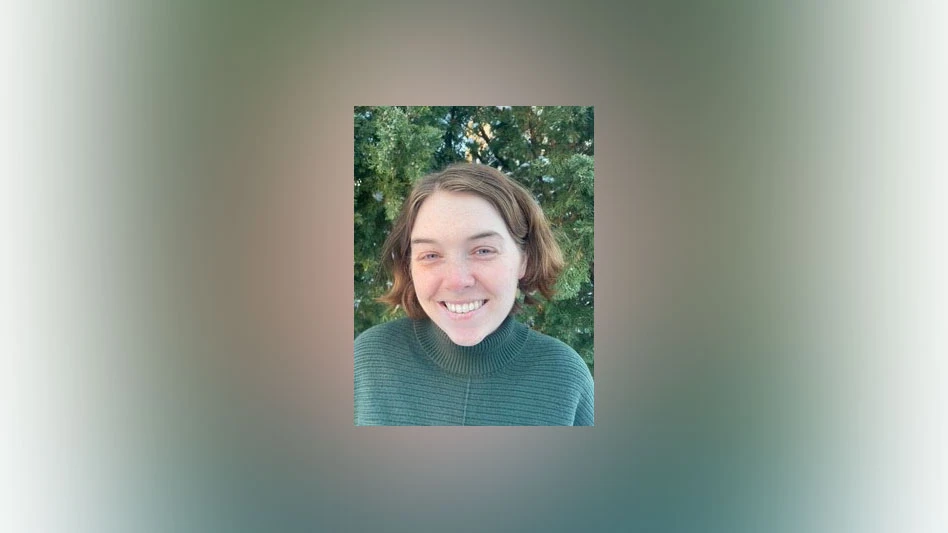 Photo of a white woman with brown hair smiling